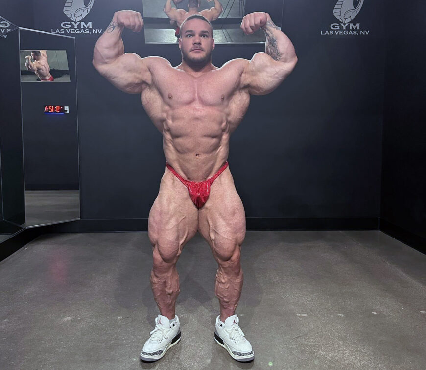 Body Builder Posing - Side Chest. Strong healthy power fitness handsome  athletic man with muscular trained body flexing his chest and biceps on  black Stock Photo - Alamy