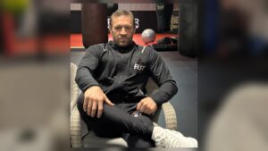 Conor McGregor seated in a gym