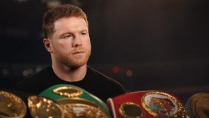 Canelo Alvarez with championship boxing belts