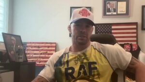 Colby Covington sits with the RAF belt after wrestling Arman Tsarukyan