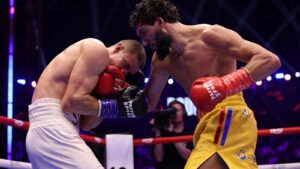 Hamzah Sheeraz lands to the body against Simon Zachenhuber in Jeddah