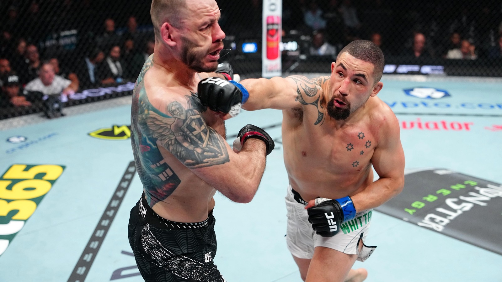 Robert Whittaker Laughs Off Joe Rogan’s UFC 329 Physique Talk After Fighting At 230 Pounds: ‘Do I Look That Out Of Shape?’