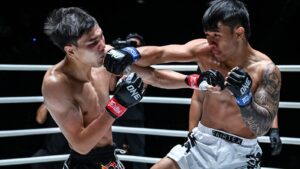 Panpadej Looksuan punches Khunpon Aekmuangnon during their ONE Friday Fights 166 Muay Thai main event