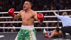 Isaac Pitbull Cruz celebrates after stopping Nestor Bravo in round six