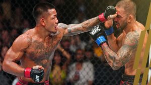 Joshua Van punches Alexandre Pantoja during their UFC 331 Fight of the Night