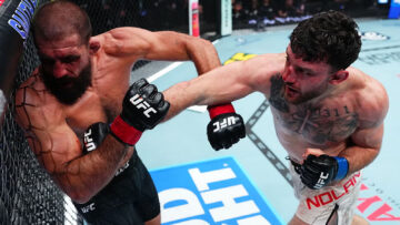 Eric Nolan lands a punch on Court McGee during their UFC 332 welterweight fight