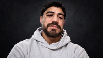 Joseph JoJo Diaz Jr. wearing a light grey hoodie