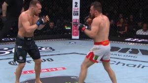 Merab Dvalishvili and Petr Yan exchange during the second round of their UFC 323 rematch